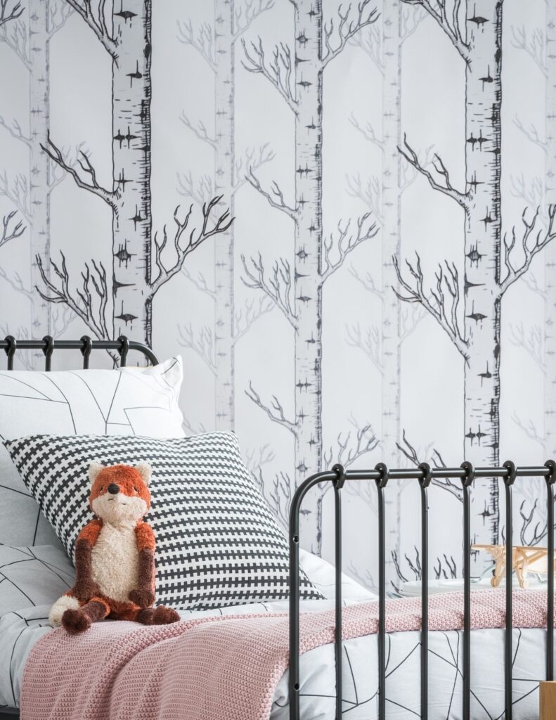 child's bedroom with trees on wall