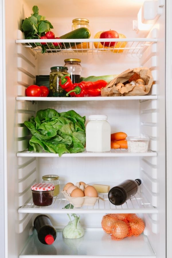 inside of a refrigerator with food in it 