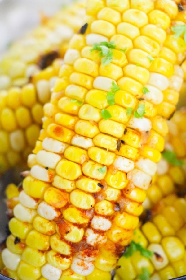 close up of corn on the cob with spices on it 