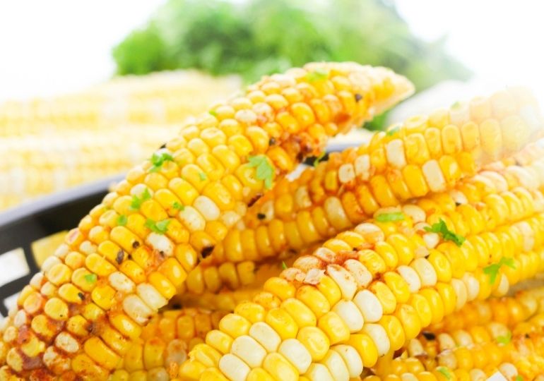 basket with corn ribs stacked inside on counter 