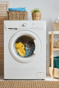 view of washer in home with laundry inside