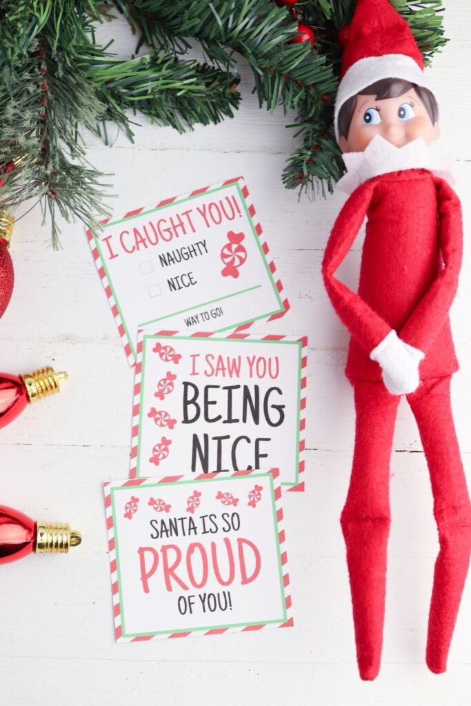 elf on shelf on counter with printables by him 