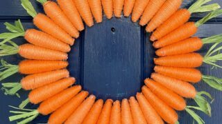 carrot wreath on a blue front door