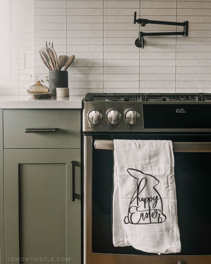 Easter towel hung on stove in kitchen 