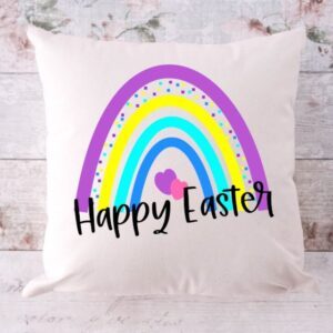 rainbow easter pillow on wooden background